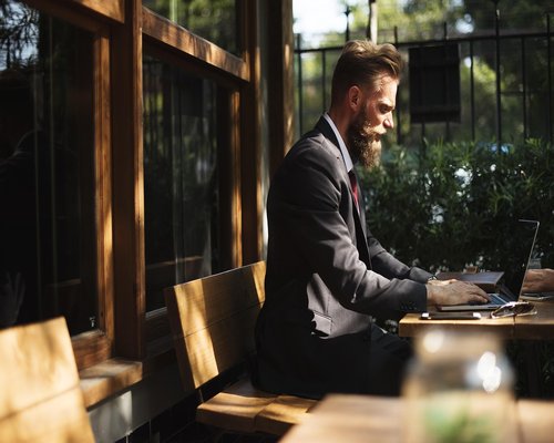 Busy person working with coffee in cafe